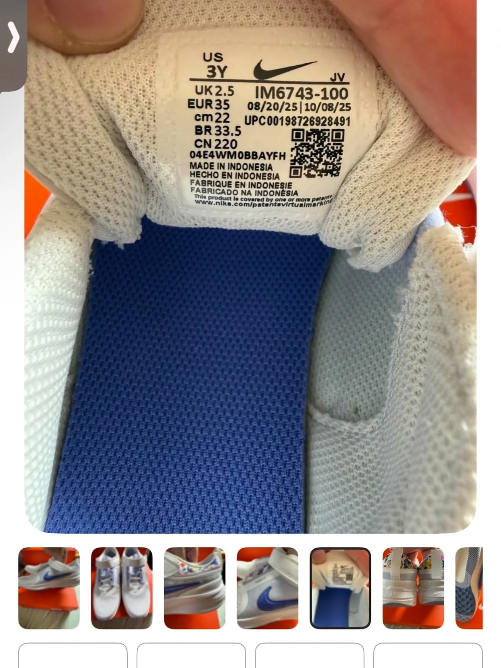 Nike White Kids Sneakers with Blue Swoosh and Multicolor Collar